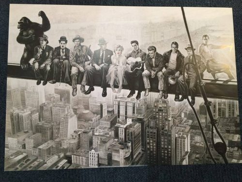 Celebrating 50 years in film (film characters on a skyscraper beam)
