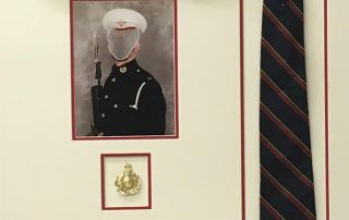 Framed royal marines tie, hat and memorabilia