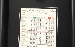 Framed golf ball and golf scorecard